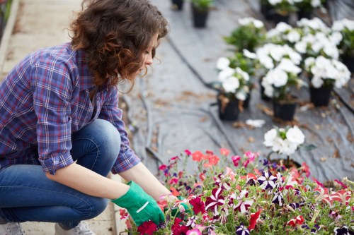 Gardener with tools beginning a garden safety assessment